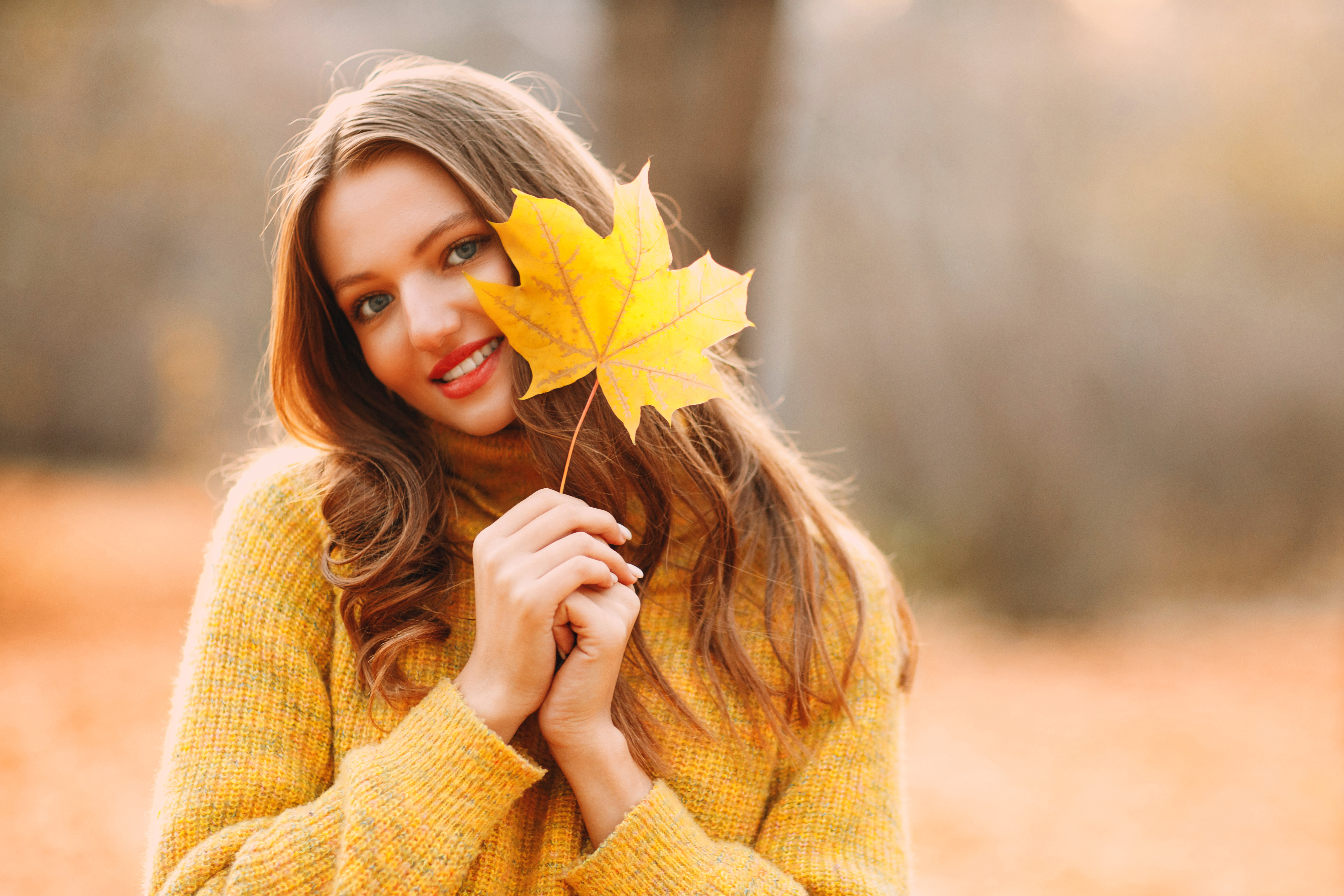 portrait young woman holding flower.